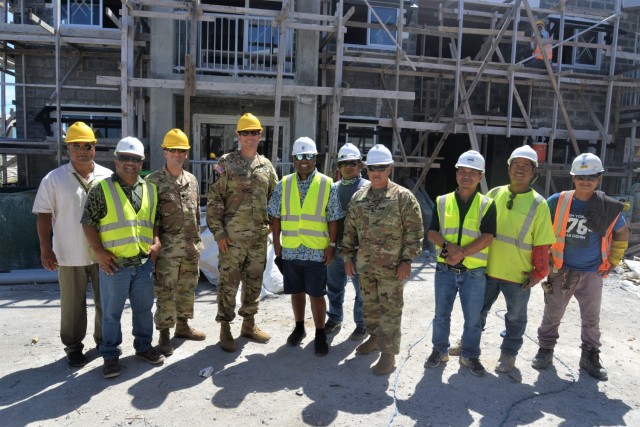 Personnel from U.S. Army Garrison-Kwajalein Atoll command, the Kwajalein Atoll Development Authority and Pacific International, Inc., a company contracted by the Republic of the Marshall Islands to build mid-atoll corridor housing, visit an Ebeye housing construction site July 16, 2021. (U.S. Army photo by Mike Brantley)