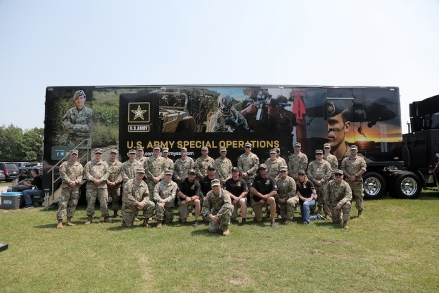 Brig. Gen. Ernest Litynski (front row, center) commanding general of the 85th U.S. Army Reserve Support Command, poses with Army recruiters during an enlistment event held in conjunction with a NASCAR Cup Series race.