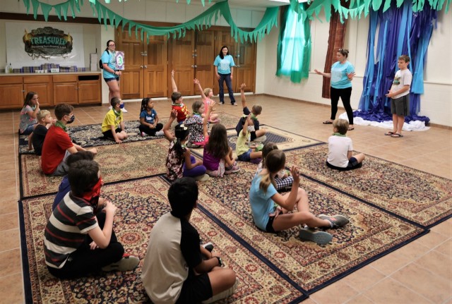 Children participate in interactive activities as part of the week’s “treasured” theme.