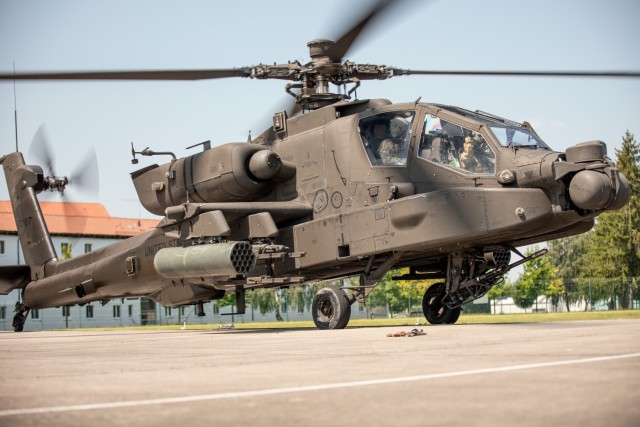 A U.S. Army AH-64 Apache Attack Helicopter flown by Charlie Company “Ghost Riders,” 1st Battalion, 1st Aviation Regiment, 1st Combat Aviation Brigade prepares to take off at Illesheim Army Airfield, Germany, July 22, 2021. The 1CAB is currently deployed to Germany in support of Atlantic Resolve. The deployment of ready, combat-credible U.S. forces to Europe in support of Atlantic Resolve is evidence of the strong and unremitting U.S. commitment to NATO and Europe. (U.S. Army photo by Staff Sgt. George B. Davis/Released)