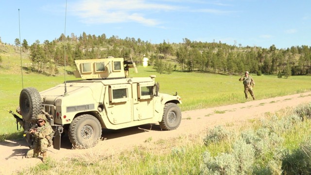 First Army OC/Ts of 2nd Battalion, 307th Field Artillery Regiment, 157th Infantry Brigade, First Army Division East, observe and evaluate a FTX convoy security lane, testing the 995th Support Maintenance Company, of the 130th Field Artillery Brigade, during XCTC 21-05, at Camp Guernsey, Wyoming, on June 11, 2021.