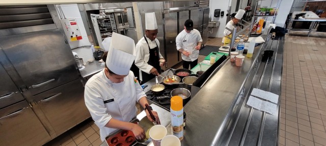 The Fort Drum Student Chef team practices a run-through of their menu at the Fort Drum Culinary Arts Center. Since the beginning of May, five culinary specialists from across the 10th Mountain Division (LI) have reported daily to the Fort Drum Culinary Arts Center with the goal of creating a championship-winning menu for the 2021 American Culinary Federation (ACF) National Competition in Orlando, Florida. (Photo by Mike Strasser, Fort Drum Garrison Public Affairs)