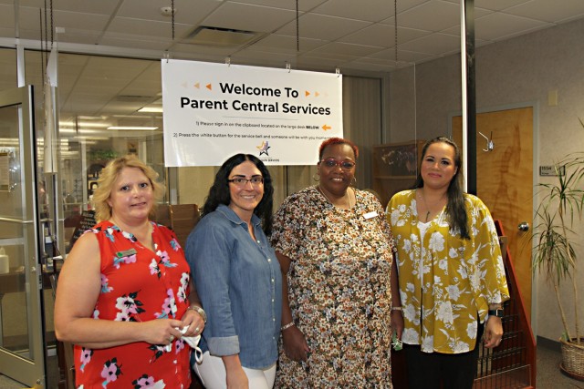 Karen Barton-Gardea, Michelle Paris, Robin Garrett, and Gina Olivas assist Soldiers and their spouses with registration for child care and other Child & Youth Services programs at Fort Sill, Oklahoma.