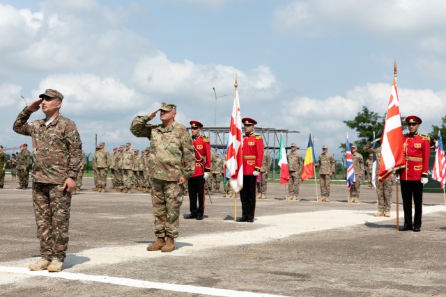 U.S. and allied soldiers attending Exercise Agile Spirit 2021 salute during a ceremony July 26, 2021, at Senaki Air Base, Georgia. Agile Spirit 21 promotes regional stability and security, while increasing readiness, strengthening partner...