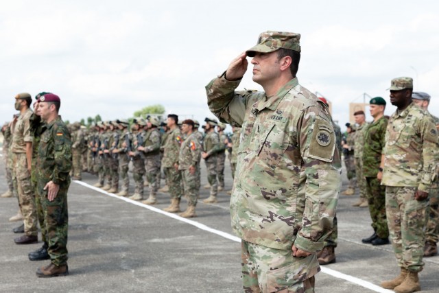 U.S. Army Sgt. Maj. Steven Phoenix, the senior enlisted advisor with the 110th Combat Sustainment Support Battalion, 78th Troop Command, Georgia Army National Guard, salutes during the opening ceremony of Exercise Agile Spirit 2021, July 26, 2021,...
