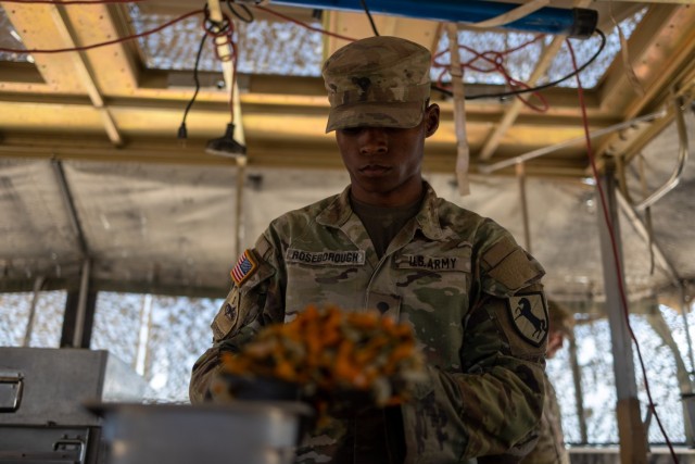 Spc. Courtney Roseborough, assigned to Regimental Support Squadron, 11th Armored Cavalry Regiment, prepares food at the field feeding site, National Training Center and Fort Irwin, Calif., July 20th, 2021. He is part of the 11th Armored Cavalry Regiment field feeding team representing the National Training Center for the Philip A. Connelly Active Army Kitchen Competition.

(U.S. Army photo by Capt. Evan Cain, 11th ACR Public Affairs Office)