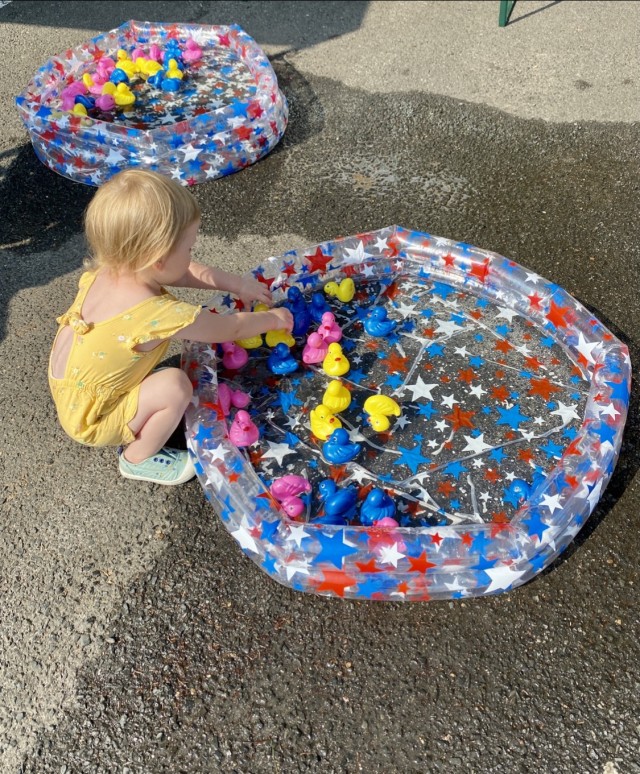 Isla Stinson plays in the duck pond at the Army Community Service birthday bash.