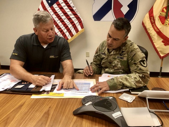 Retired Lt. Gen. Raymond Mason, Army Emergency Relief director (left), discusses updated AER processes to Fort Stewart-Hunter Army Airfield Garrison Commander, Col. Manny Ramirez (right), during a meet-and-greet session, July 20 at the Garrison...