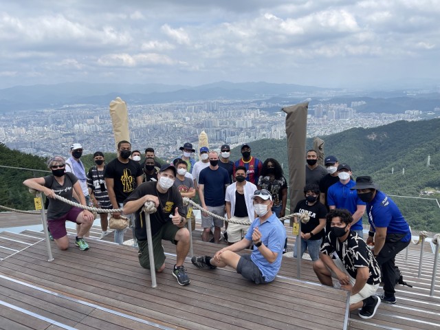 Ch. (Lt. Col.) Hyokchan Kim, seated, center, with 19th Expeditionary Sustainment Command Soldiers during a spiritual fitness event on Apsan Mountain in Daegu, Republic of Korea. Ch. Kim became an Army chaplain after spending more than a decade as...