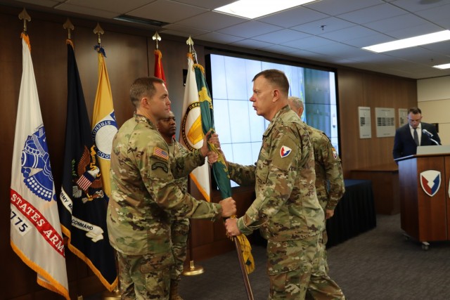 (From right) During a July 28 change of charter ceremony, Brig. Gen. Garrick Harmon, commanding general of the U.S. Army Security Assistance Command, passes the colors to Col. Kenneth Burgess, who will lead the Office of the Program Manager-Saudi Arabian National Guard in Riyadh, Saudi Arabia. The change of charter ceremony was hosted by Harmon and held at USASAC Headquarters, Redstone Arsenal, Alabama. Burgess will now serve as the organization’s 25th program manager.  He comes to OPM-SANG from Vicenza, Italy, where he commanded the 173rd Infantry Brigade Combat Team (Airborne). For more information about OPM-SANG’s Riyadh-based foreign policy mission, visit https://www.army.mil/opm-sang.