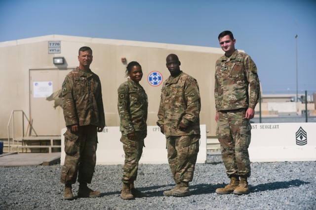CAMP ARIFJAN, Kuwait-- Master Sgt. Lloyd Cossey, Staff Sgt. Steve Augusten, Sgt. Nichole Hall and Spc. Patrick H. Watrous with the Army Reserve's Indianapolis-based 310th Sustainment Command (Expeditionary) returned here recently after providing support to Soldiers at Afghanistan's Bagram Air Base.