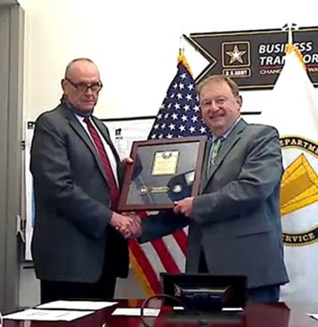 Dr. James Moyer (Deputy Chief of Staff, G-8, U.S. Army Europe) accepts the 2020 Lean Six Sigma Excellence for an Enterprise Level Process Improvement Project on behalf of U.S. Army Europe.