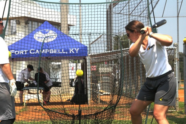 Captain Alexandrea Rashenskas, 759th Military Police Battalion, Fort Carson, Colo., takes practice swings off the tee July 23 at Fort Campbell. Tryouts started July 22 and will continue through Aug. 2 when coaching staff makes the final cut. This...
