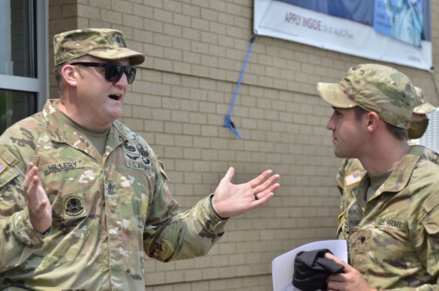 First Sergeant Anthony Hillery, 717th Ordnance Company, 184th Ordnance Battalion, 52nd Ordnance Group (Explosive Ordnance Disposal), left, tells Spc. Brent Tucke, 2nd Battalion, 506th Infantry Regiment, 3rd Brigade Combat Team, 101st Airborne...