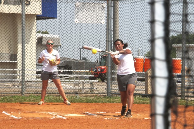 At bat is Sgt. Summer Allen 3rd Recruiting Brigade, Knoxville, Tenn., while Sgt. Samantha Baker, 7th Special Forces Group, Fort Bragg, N.C., catches behind the plate July 23 at Fort Campbell. Tryouts started July 22 and will continue through Aug....