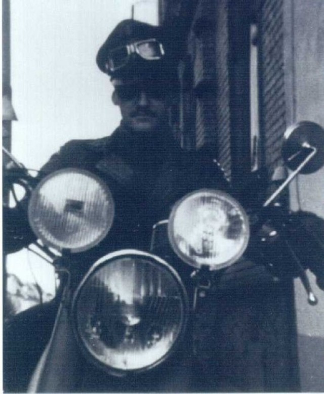 Carlo Riva rides a motorcycle in 1970s Germany. Riva, who left a life in several biker gangs in the early 80s, now uses his experiences to help others.