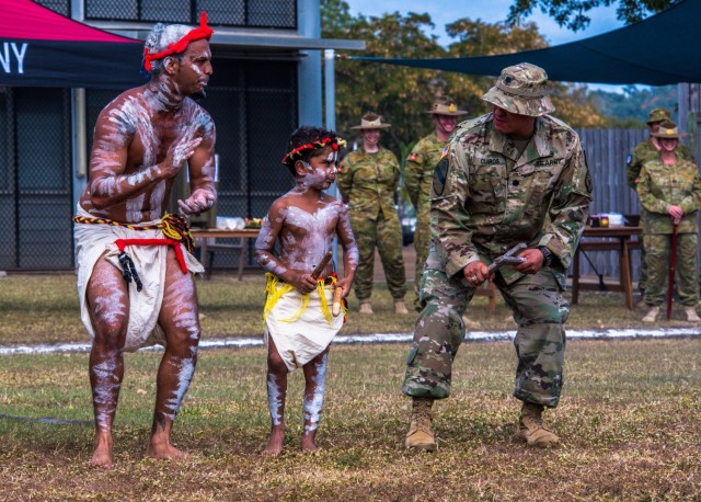 U.S. Army Lt. Col. Joseph Claros, 17th Sustainment Brigade Executive Officer serving as Deputy Commander for the Combined Joint Task Support Group for Exercise Talisman Sabre 21, perform a traditional dance with members of the Bindal clan at a Welcome to Country Ceremony, at Lavarack Barracks, Townsville, Queensland, July 19, 2021.TS 21 supports the U.S. National Defense Strategy by enhancing our ability to protect the homeland and provide combat-credible forces to address the full range of potential security concerns in the Indo-Pacific. (U.S. Marine Corps photo by Cpl. Michael Jefferson C. Estillomo)