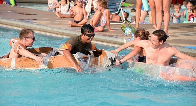 Seminar 5 competitors Maj. Michael Pierri and Pakistani Maj. Yasin Javed collide with Seminar 8 "dragon boat" competitors British Maj. Philip Anderson and Maj. Megan OKeefe as Pierri and Javed try to complete their first lap and Anderson and...