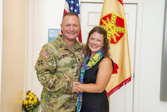 Lt. Col. Andrew White stands with his with, Stacy, after taking command of Natick Soldier Systems Center on July 1, 2021.