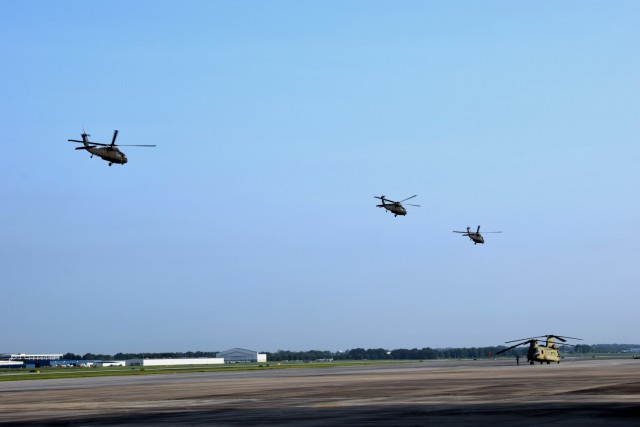 A group of UH-60V Black Hawk helicopters departs Huntsville Alabama International Airport July 26 bound for the Pennsylvania Army National Guard Eastern ARNG Aviation Training Site (EAATS) at Fort Indiantown Gap. PEO Aviation’s Utility Helicopters Project Office completed the delivery July 27 of five UH-60Vs to EAATS, which becomes the first unit equipped and organically assigned with the aircraft. (Photo by Nathaniel Letson)