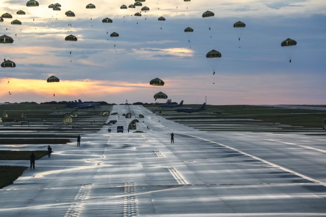 Soldiers from 1st Special Forces Group and members of the Japan Ground Self-Defense Forces Group, complete a joint airborne operation on Andersen Air Force Base, Guam, July 30, 2021. Exercise Forager 21 is designed to test and refine the multi-domain capabilities with our allies in the Indo-Pacific theatre. (U.S. Army photo by Cpl. Carlie Lopez, 28th Public Affairs Detachment)