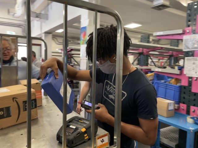 Jayden Reed processes an incoming mail parcel at Caserma Ederle's post office, located in Vicenza, Italy, Monday, July 26, 2021. Processing mail parcels is an important step in their delivery.