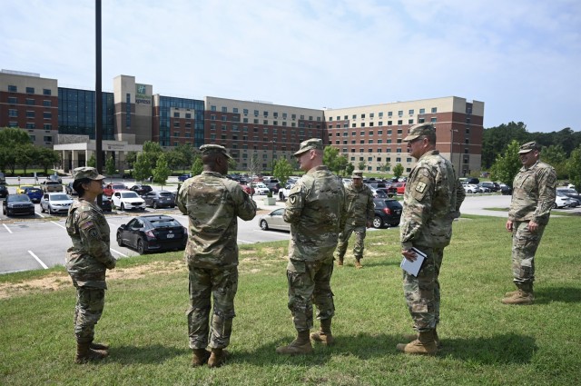 General Edward Daly, Commanding General, Army Materiel Command is briefed on the concept of operation Allies Refuge by Combined Arms Support Command commanding general, Maj. Gen. Mark Simerly.