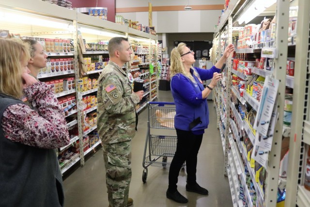 Fort McCoy Commissary Store Manager Kim Graham demonstrates how to fill an order July 26, 2021, for the CLICK2GO online ordering and curbside service at the Fort McCoy Commissary at Fort McCoy, Wis. The Fort McCoy Commissary began using the...