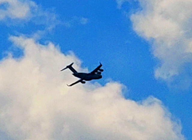 A C-17 Globemaster III soars through the sky Aug. 1, 2021, after taking off from Sparta-Fort McCoy Airport at Fort McCoy, Wis.The C-17 Globemaster III is the most flexible cargo aircraft to enter the airlift force for the U.S. Air Force,...