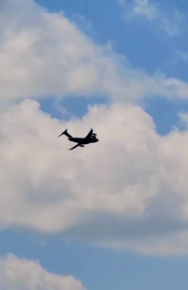 A C-17 Globemaster III soars through the sky Aug. 1, 2021, after taking off from Sparta-Fort McCoy Airport at Fort McCoy, Wis.The C-17 Globemaster III is the most flexible cargo aircraft to enter the airlift force for the U.S. Air Force,...