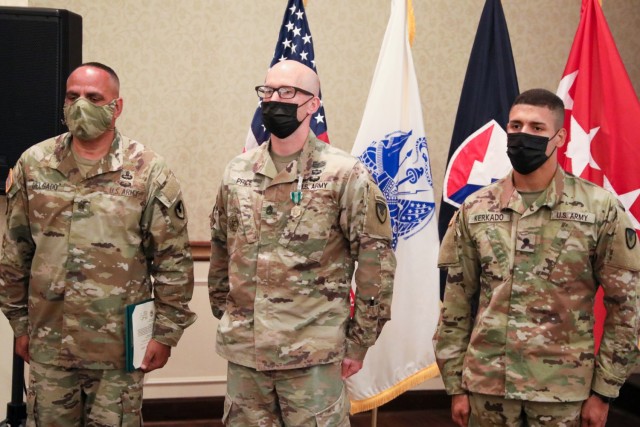 Army Materiel Command’s senior enlisted leader, Command Sgt. Maj. Alberto Delgado (left), recognizes AMC’s Soldier and noncommissioned officer of the year. (U.S. Army photo by Eben Boothby)