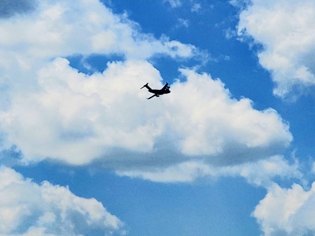 A C-17 Globemaster III soars through the sky Aug. 1, 2021, after taking off from Sparta-Fort McCoy Airport at Fort McCoy, Wis.The C-17 Globemaster III is the most flexible cargo aircraft to enter the airlift force for the U.S. Air Force,...