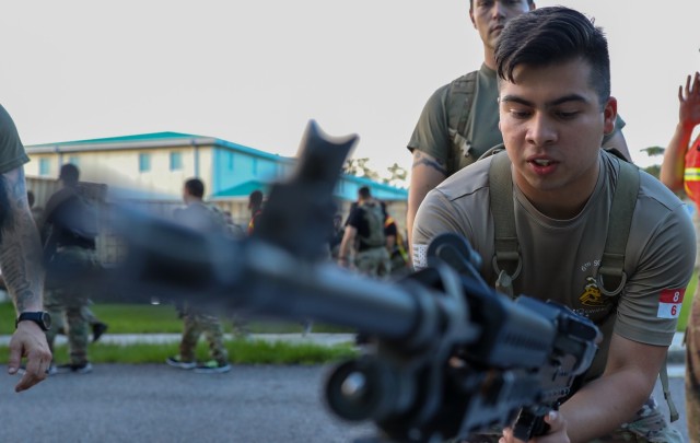 Spc. Danny Castillo, a cavalry scout assigned to 6th Squadron, 8th Cavalry Regiment, 2nd Armored Brigade Combat Team, 3rd Infantry Division, prepares to disassemble a M240B machine gun during the Iron Spartan event at Fort Stewart, Georgia, June...