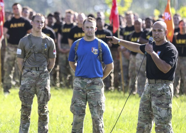 Command Sgt. Maj. Jaime Lopez, the senior enlisted advisor of the 2nd Armored Brigade Combat, 3rd Infantry Division, recognizes Sgt. Hunter Davidson assigned to 3rd Battalion, 15 Infantry Battalion, for wining the XVIII Airborne Corps' Noncommissioned Officer of the Year Competition, during the Iron Spartan Competition closing ceremony Fort Stewart, Georgia, June 25, 2021. The comprehensive, timed competition sought to build a team inside a team in company formations, demonstrate the physical capability of an armored brigade combat team, and show that “People First” really means preparing Soldiers to fight, win, and come home from the nation’s wars through tough, realistic training. (U.S. Army photo by Staff Sgt. Brian K. Ragin Jr.)