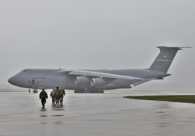 An Air Force C-5M Super Galaxy and aircrew from Dover Air Force Base, Del., carrying Soldiers with the 3rd Brigade Combat Team, 10th Mountain Division of Fort Polk, La., parks on the parking ramp July 7, 2021, as part of an Emergency Deployment...