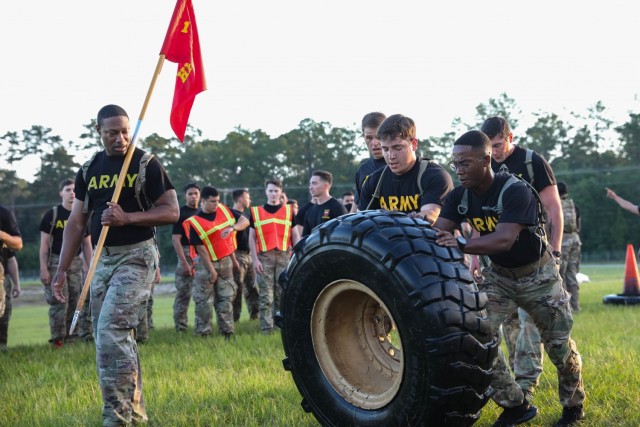 Soldiers from 1st Battalion, 9th Field Artillery Regiment, 2nd Armored Brigade Combat Team, 3rd Infantry Division, Fort Stewart, Georgia participate in the tire flip portion of the Iron Spartan Fitness Competition at Fort Stewart, Georgia. The comprehensive, timed competition sought to build a team inside a team in company formations, demonstrate the physical capability of an armored brigade combat team, and show that “People First” really means preparing Soldiers to fight, win, and come home from the nation’s wars through tough, realistic training. (U.S. Army photo by Pfc. Caitlin Wilkins, 50th Public Affairs Detachment)