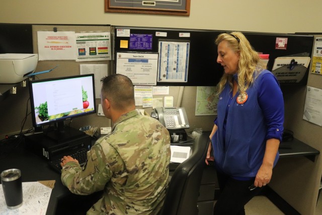 Fort McCoy Garrison Deputy Commander Lt. Col. Chad Maynard learns how to sign up for an account July 26, 2021, for the CLICK2GO online ordering and curbside service at the Fort McCoy Commissary at Fort McCoy, Wis. The Fort McCoy Commissary began...