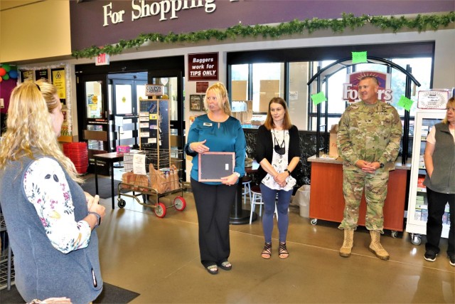 Members of the Fort McCoy Commissary team listen in as they receive a certificate of appreciation July 27, 2021, from Garrison Commander Col. Michael Poss and Sexual Assault Response Coordinator Rebecca Wilkinson with the Directorate of Family and...