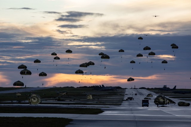 ANDERSEN AIR FORCE BASE, Guam – U.S. Army Green Berets with 1st Battalion, 1st Special Forces Group (Airborne), descend on a drop zone alongside members of the Japan Ground Self-Defense Force after flying from Yokota Air Base, Japan, July 30, 2021. Exercise Forager 21 is a U.S. Army Pacific exercise designed to test and refine the Theater Army’s ability to flow landpower forces into the theater, execute command and control of those forces, and effectively employ them in support of our allies, partners, and national security objectives in the region. About 4,000 U.S. personnel are directly participating in Forager 21. (U.S. Army photo by Spc. Thoman Johnson)