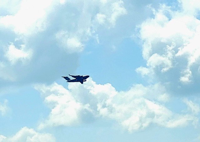 A C-17 Globemaster III soars through the sky Aug. 1, 2021, after taking off from Sparta-Fort McCoy Airport at Fort McCoy, Wis.The C-17 Globemaster III is the most flexible cargo aircraft to enter the airlift force for the U.S. Air Force,...