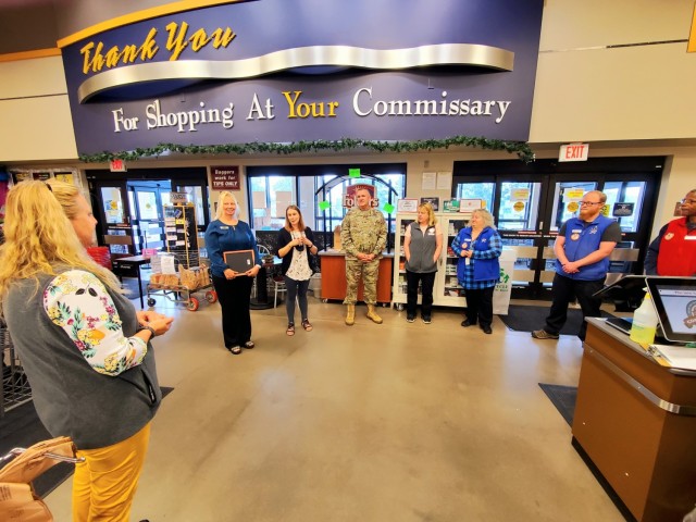 Members of the Fort McCoy Commissary team listen in as they receive a certificate of appreciation July 27, 2021, from Garrison Commander Col. Michael Poss and Sexual Assault Response Coordinator Rebecca Wilkinson with the Directorate of Family and...