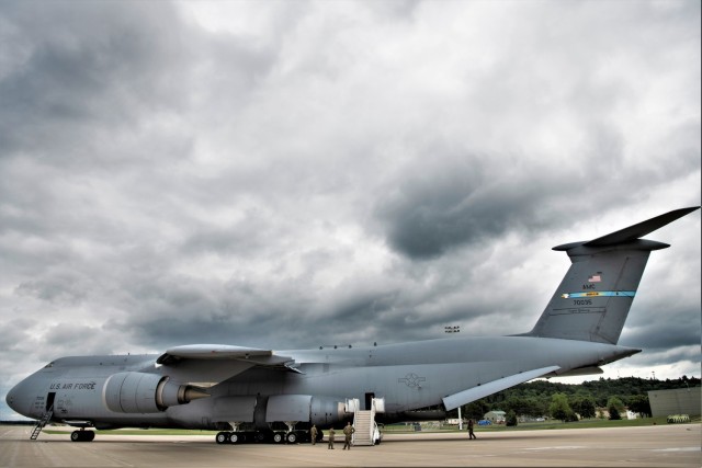 An Air Force C-5M Super Galaxy from Dover Air Force Base, Del., carrying Soldiers with the 3rd Brigade Combat Team, 10th Mountain Division of Fort Polk, La., parks in a parking area July 7, 2021, as part of an Emergency Deployment Readiness...