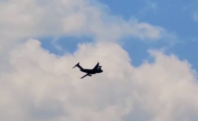 A C-17 Globemaster III soars through the sky Aug. 1, 2021, after taking off from Sparta-Fort McCoy Airport at Fort McCoy, Wis.The C-17 Globemaster III is the most flexible cargo aircraft to enter the airlift force for the U.S. Air Force,...