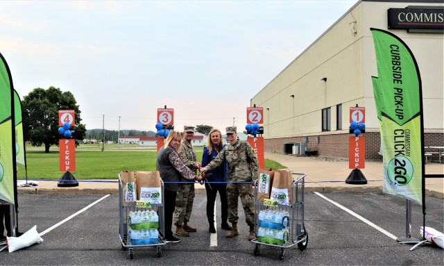 Fort McCoy Commissary Accounting Technician Kathy Minich, Garrison Deputy Commander Lt. Chad Maynard, Commissary Store Manager Kim Graham, and Command Sgt. Maj. Raquel DiDomenico, garrison command sergeant major, officially cut a ribbon July 26,...