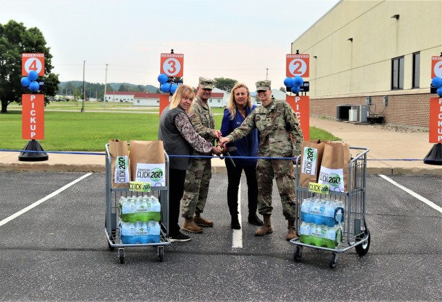 Fort McCoy Commissary Accounting Technician Kathy Minich, Garrison Deputy Commander Lt. Chad Maynard, Commissary Store Manager Kim Graham, and Command Sgt. Maj. Raquel DiDomenico, garrison command sergeant major, officially cut a ribbon July 26,...