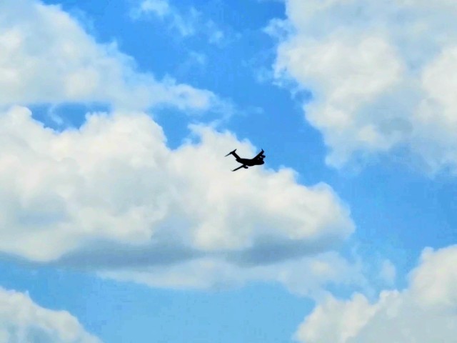 A C-17 Globemaster III soars through the sky Aug. 1, 2021, after taking off from Sparta-Fort McCoy Airport at Fort McCoy, Wis.The C-17 Globemaster III is the most flexible cargo aircraft to enter the airlift force for the U.S. Air Force,...