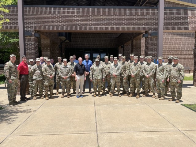 A team of 21 Dogface Soldiers, 16 from the 2nd Armored Brigade Combat Team, 3rd Infantry Division, and five from the Division headquarters take a group photo after participating in Quick Look VI at Fort Benning, Georgia, July 16, 2021. From July 12-16, the team conducted simulations to determine the impact on the relative combat power of a motorized brigade combat team conducting cross-domain maneuver equipped with new electronic warfare technologies and other enablers against a near-peer threat to help shape the future force. (Courtesy Photo)