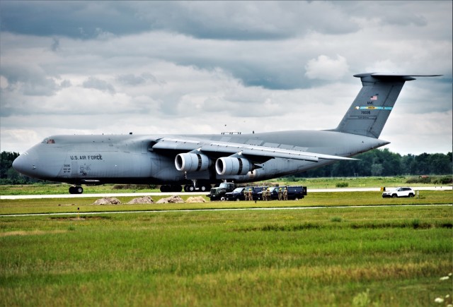 An Air Force C-5M Super Galaxy from Dover Air Force Base, Del., carrying Soldiers with the 3rd Brigade Combat Team, 10th Mountain Division of Fort Polk, La., parks in a parking area July 7, 2021, as part of an Emergency Deployment Readiness...