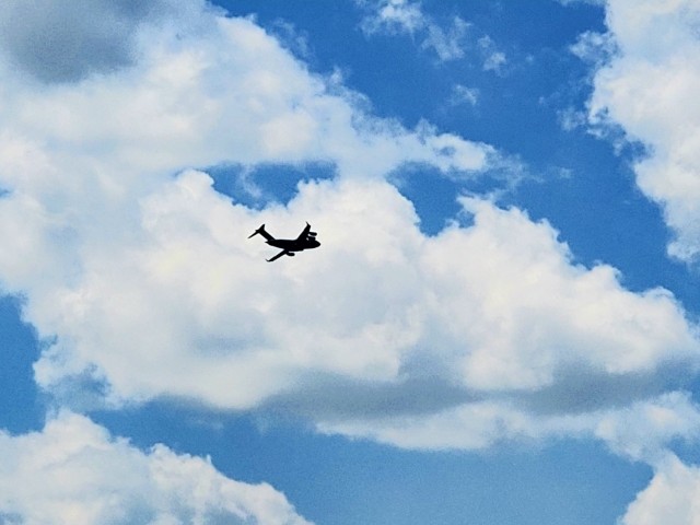 A C-17 Globemaster III soars through the sky Aug. 1, 2021, after taking off from Sparta-Fort McCoy Airport at Fort McCoy, Wis.The C-17 Globemaster III is the most flexible cargo aircraft to enter the airlift force for the U.S. Air Force,...
