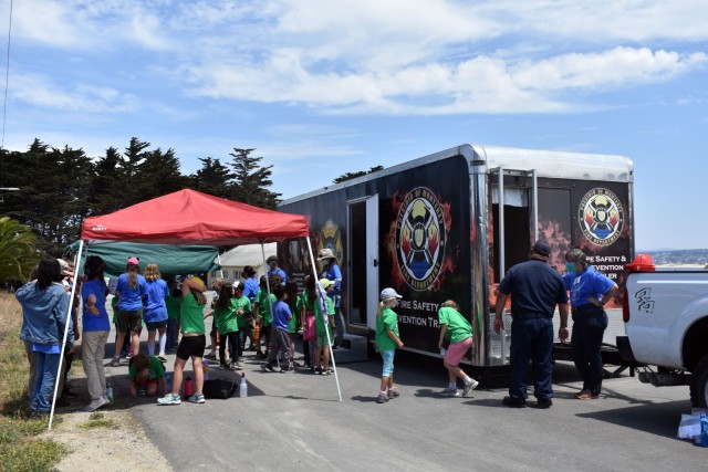 Cub Scouts await their turn inside the Presidio of Monterey Fire Department’s Fire Safety and Prevention Trailer during the Monterey Cub Scout Camp at the Presidio of Monterey, Calif., July 29.